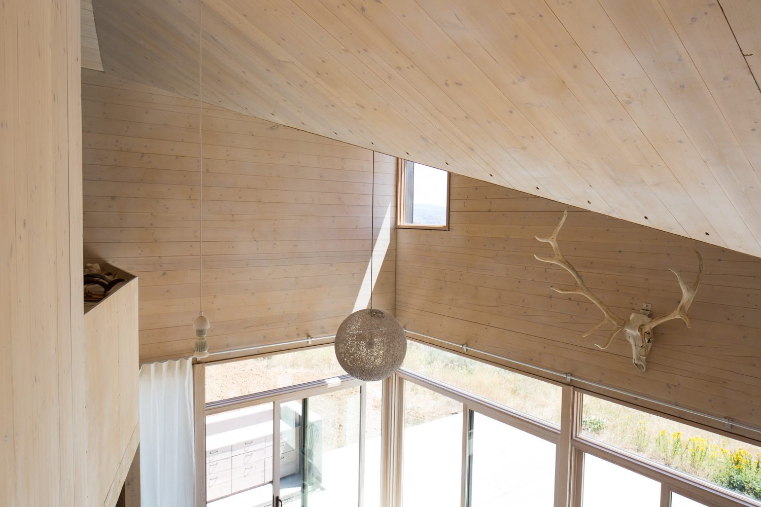 View from the loft down to the living room windows